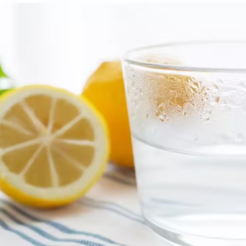 Warm lemon water for morning constipation relief.